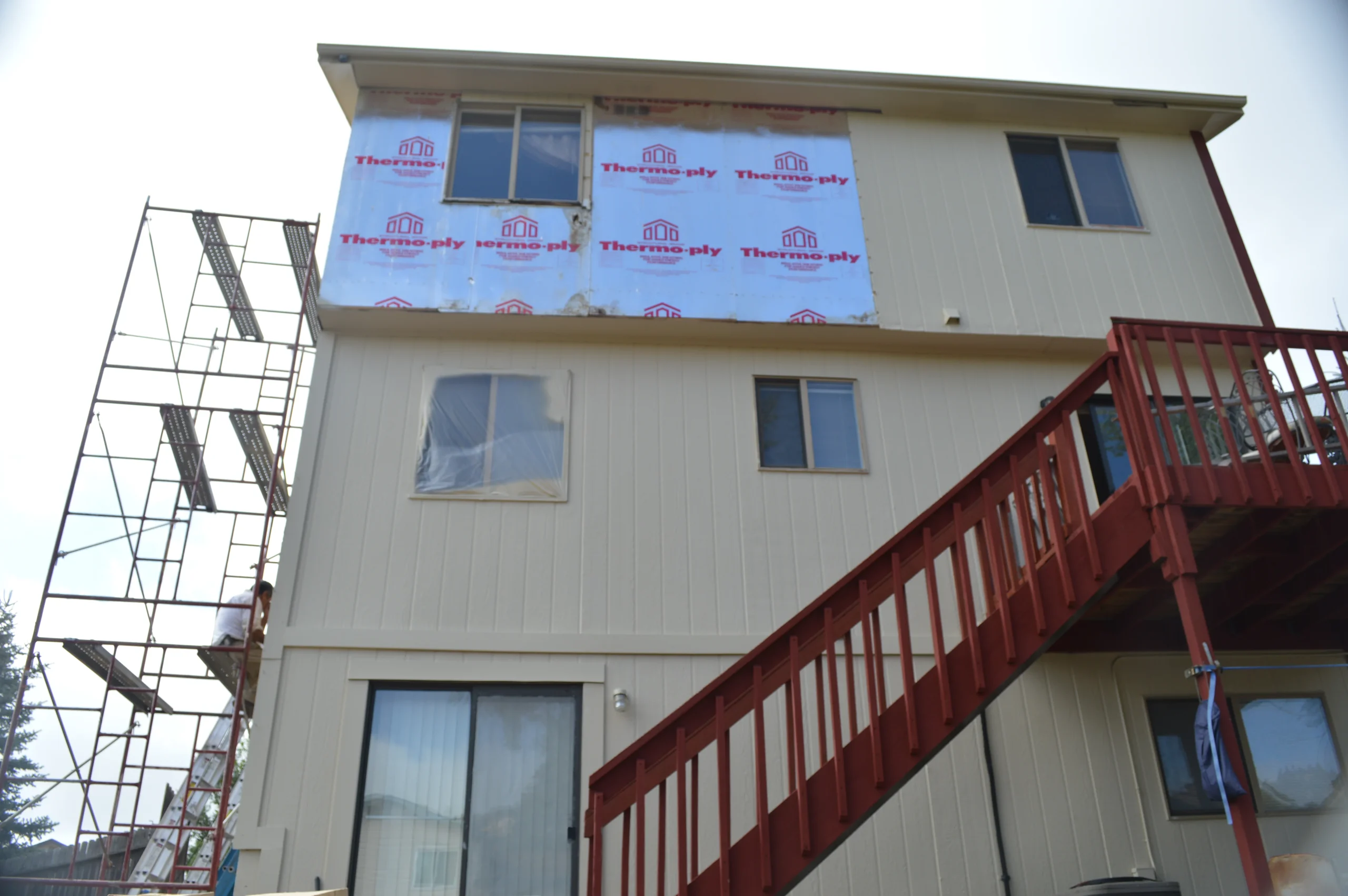 Exterior siding preparation by a painting company in Colorado Springs, CO before the finish coating system is applied