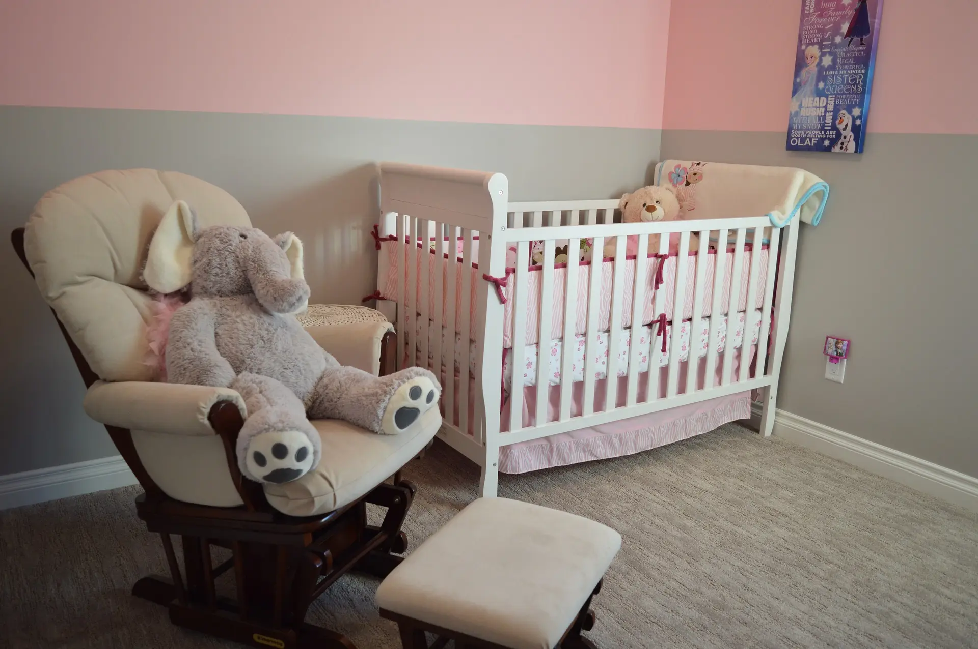 Colorado Springs interior painting in a finished pink nursery with crib and chair